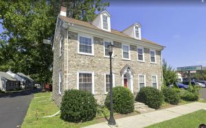 Image of two story stone house