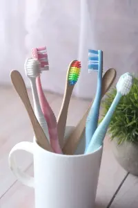 Image of tooth brushes in mug
